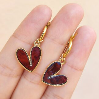 Argollas de acero dorado color bordó