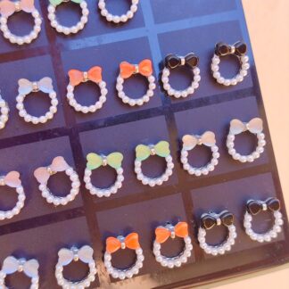 Aros moños con perlas plateados